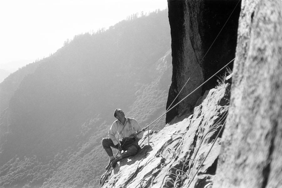 A Climber Belaying On A Ledge While Photograph by Tom Frost Fine Art