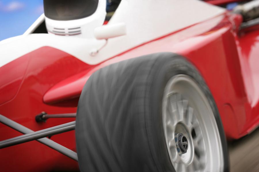 A Close-up Of A Red Race Car Photograph