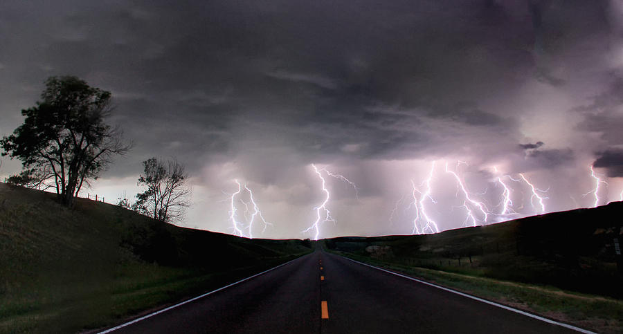 A composite image from 5 images of cloud-to-ground lightening bolts at the end of a rural road, Lexington, Nebraska, USA Photograph by Jason Persoff Stormdoctor