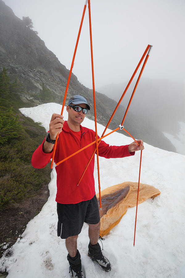 Winter Photograph - A Confused Climber Holds Up His Tent by Christopher Kimmel