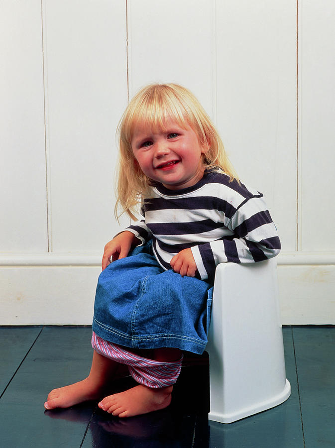 A Constipated Young Girl Using A Potty by Ron Sutherland/science