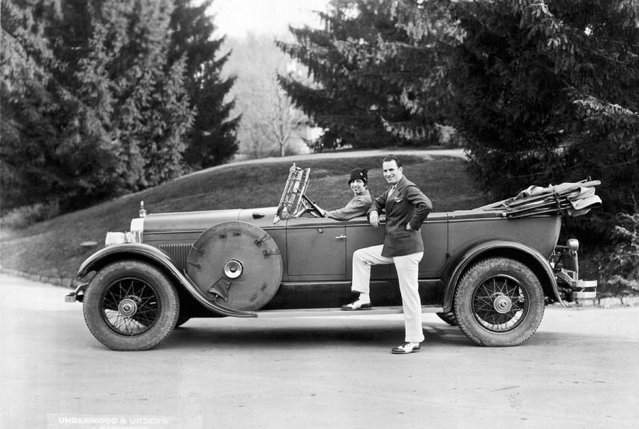 A Couple Poses By Their Car Photograph by Underwood Archives