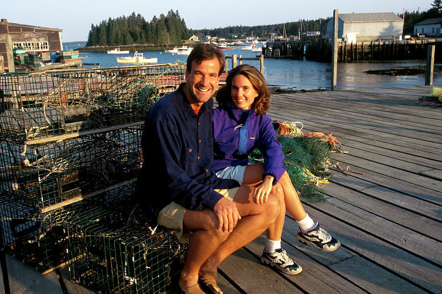 Boat Photograph - A Couple Sits On Lobster Pots by David McLain