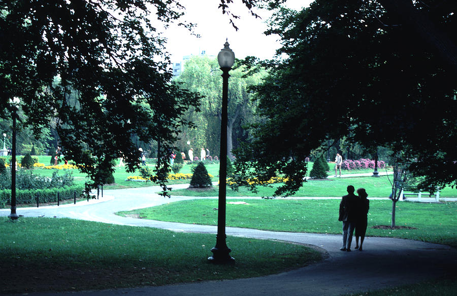 A Couple Walking Through the Boston Public Garden Photograph by Tom Wurl