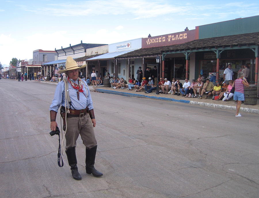 A cowboy with his camera Allen Street Tombstone Arizona 2004 Photograph by David Lee Guss
