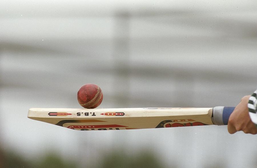 A cricket bat and ball Photograph by Laurence Griffiths