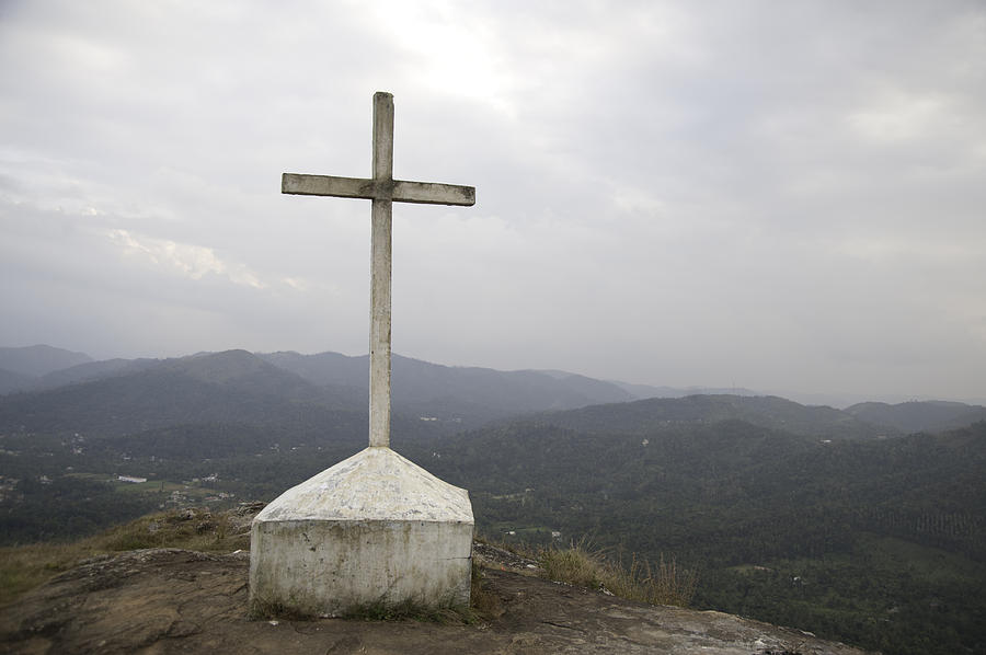 A Cross situated on the top on a mountain in Kerala in India Photograph by Ashish Agarwal