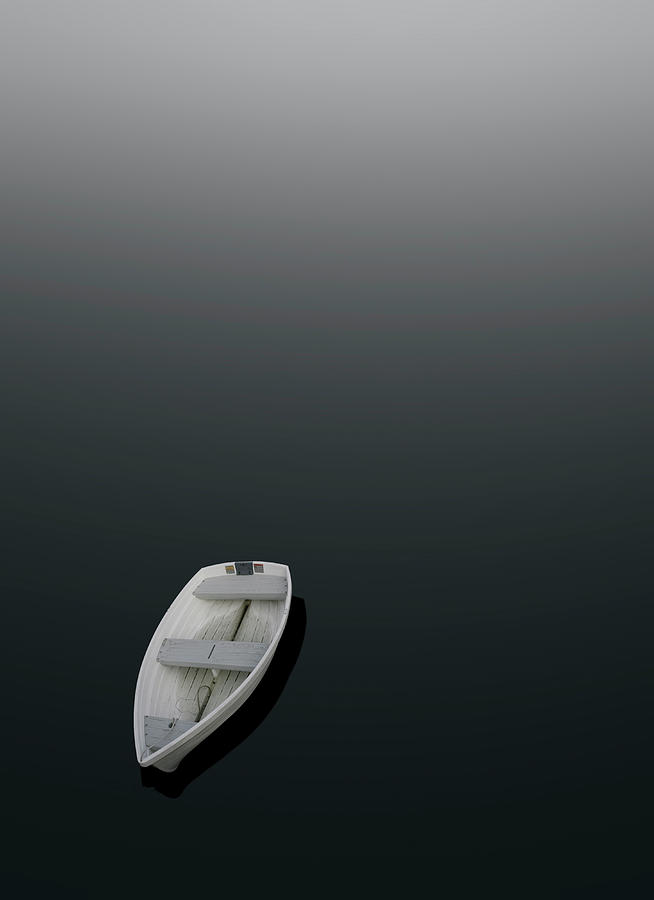 Boat Photograph - A Dinghy Floats On Calm Water by Robert Benson
