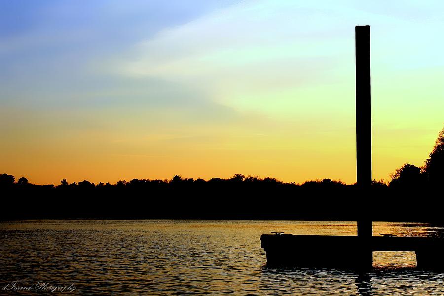 A Dock On The River at Sunset Photograph by Debra Forand