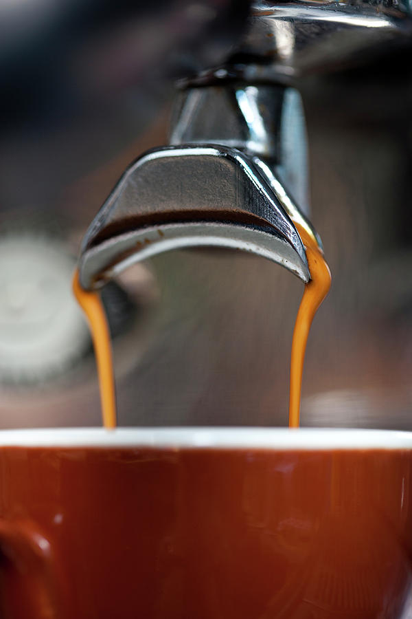 A Double Shot Of Espresso Being Poured Photograph by Halfdark