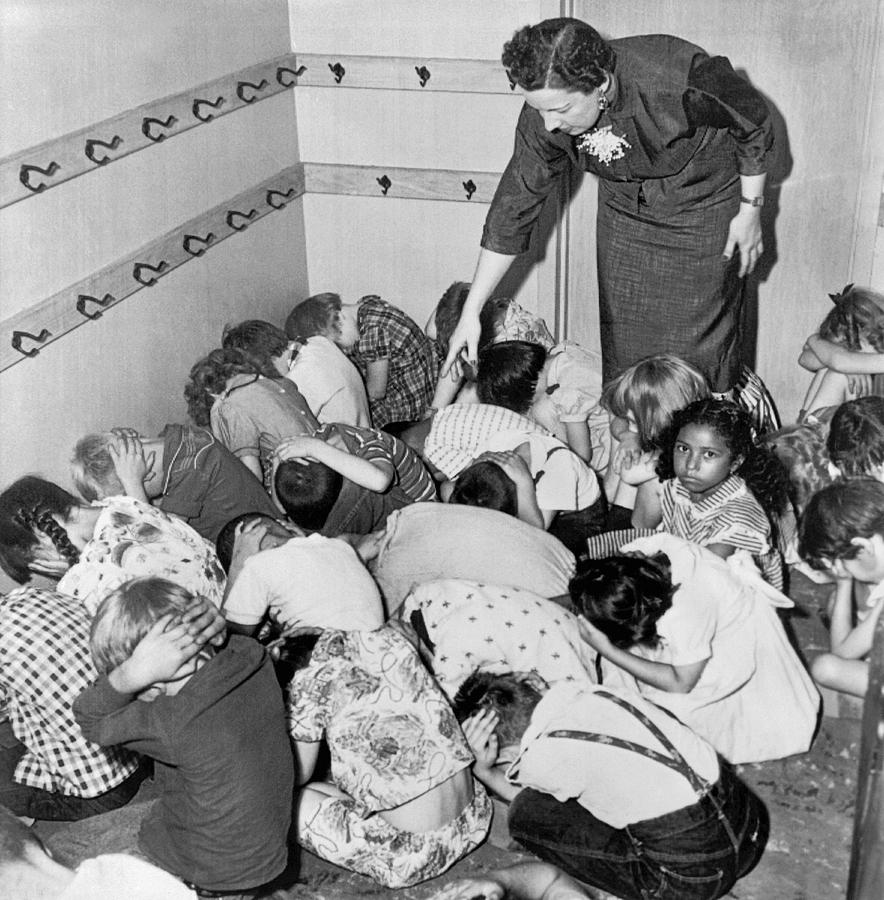 A duck and cover exercise in a kindergarten class in 1954 Photograph by Underwood Archives