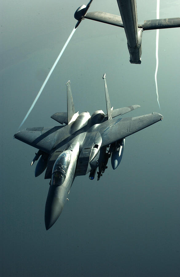 A F-15E disengaging from a KC-10 Photograph by Celestial Images