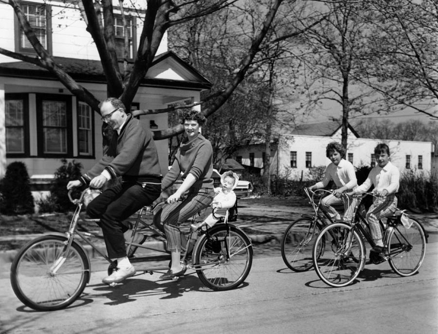 Bicycle Photograph - A Family On A Bicycle Ride by Underwood Archives