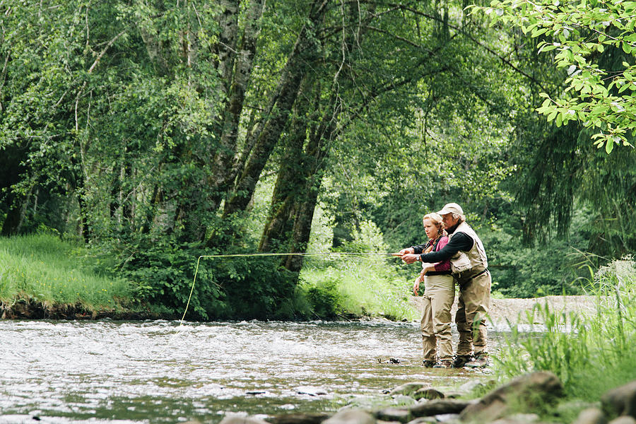 A Father And Daughter Fly Fishing by Justin Bailie