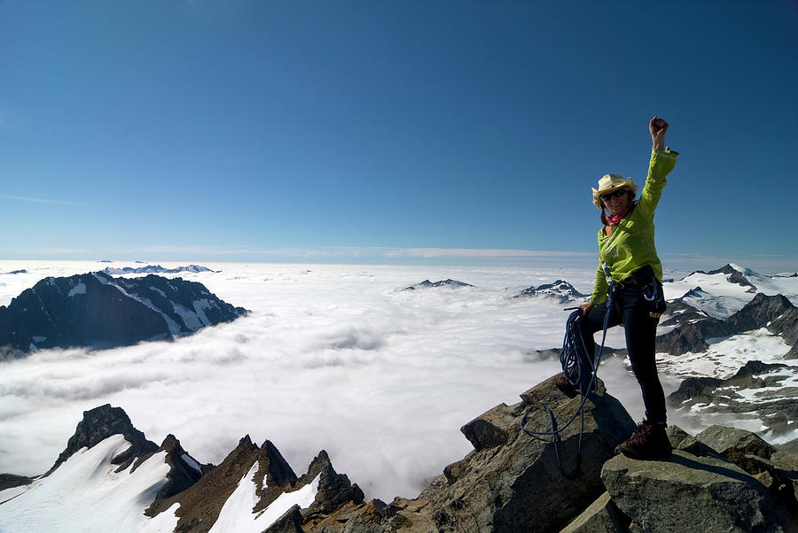 North Cascades National Park Photograph - A Female Climber Celebrates The Summit by Cliff Leight