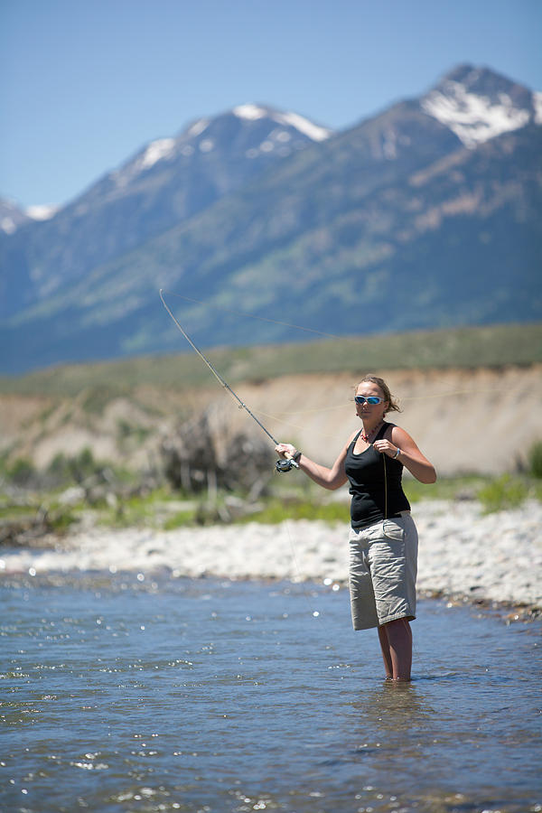 A Female Fly Fishing In Jackson Holes by Chris Ross