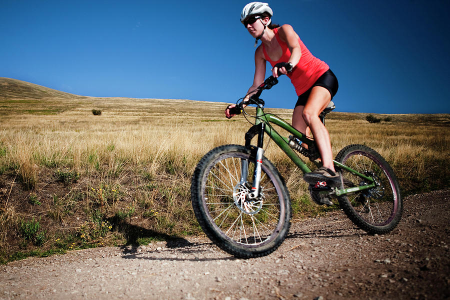 A Female Mountain Biker Pedals Photograph by Jared Alden | Fine Art America