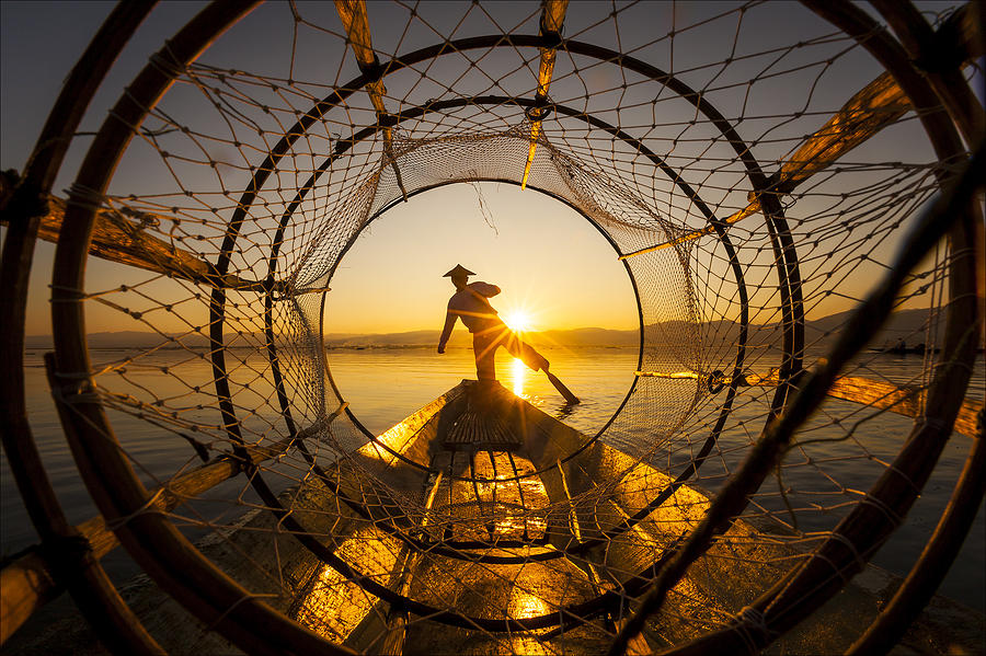 A fisherman at sunset on Inle Lake, Myanmar. Photograph by keehwan Kim