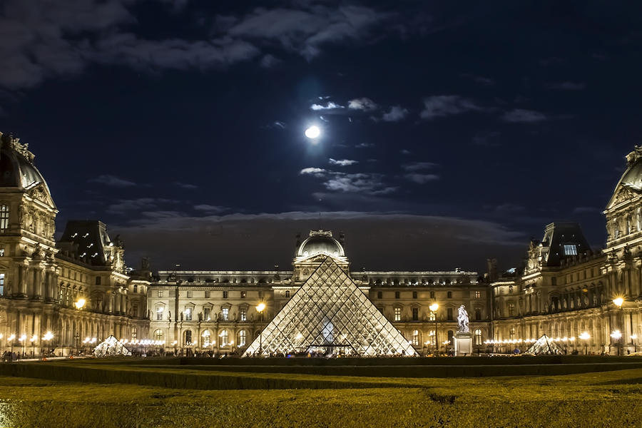 A full moon rising over the Louvre Photograph by Sven Brogren