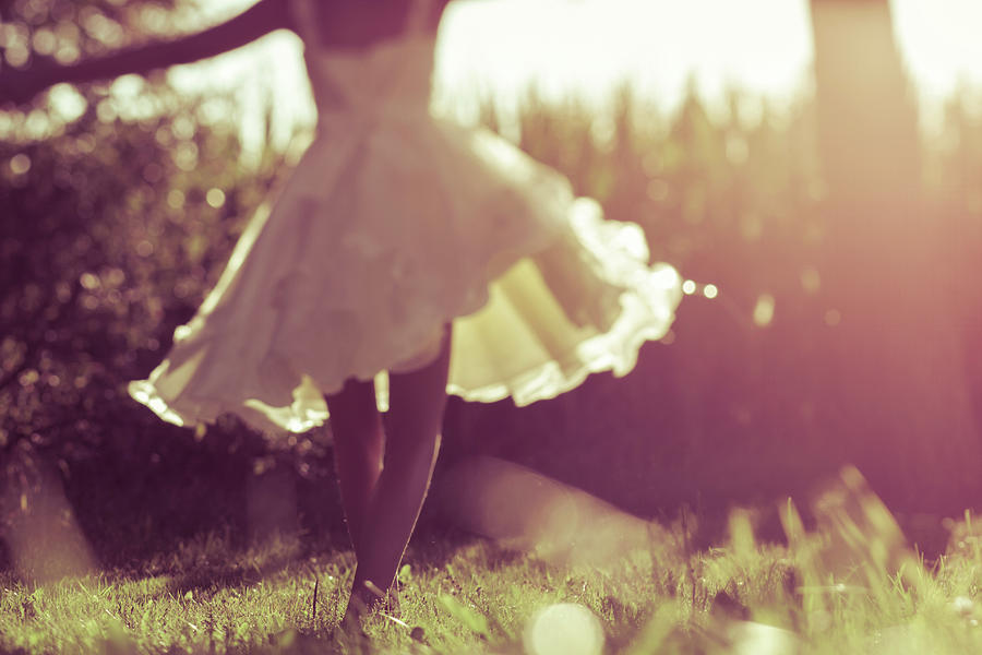 A Girl In A Yellow Dress Twirls Next To Photograph by Victoria Hederer Bell