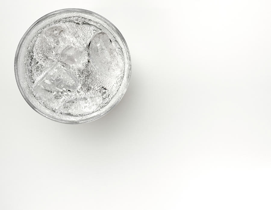 A Glass Of Sparkling Water With Ice Photograph by Anthony Bradshaw