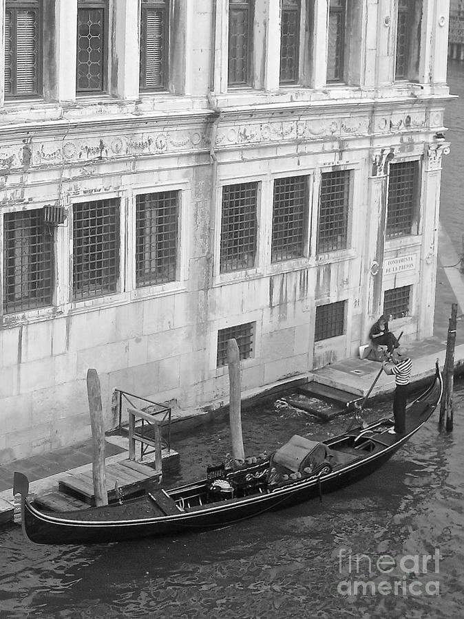 A Gondolier and His Boat Photograph by Suzanne Oesterling