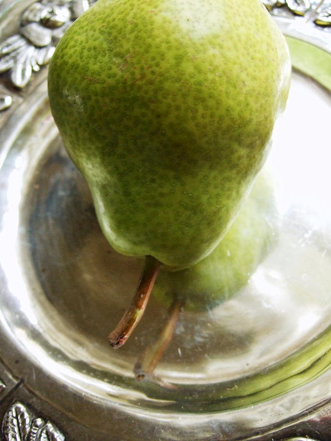 Fruit Photograph - A Green Pear on a Silver Plate by Louise Kumpf