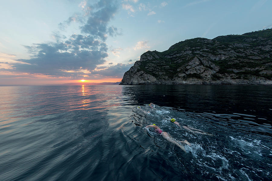 A Group Of Swimmers Swimming Photograph by Raffi Maghdessian