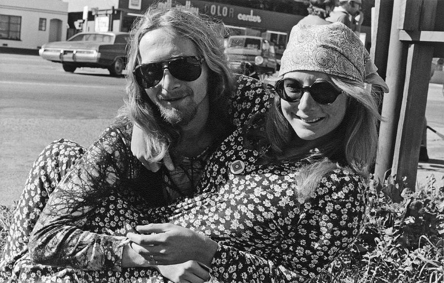 Black And White Photograph - A Happy Hippie Couple by Underwood Archives