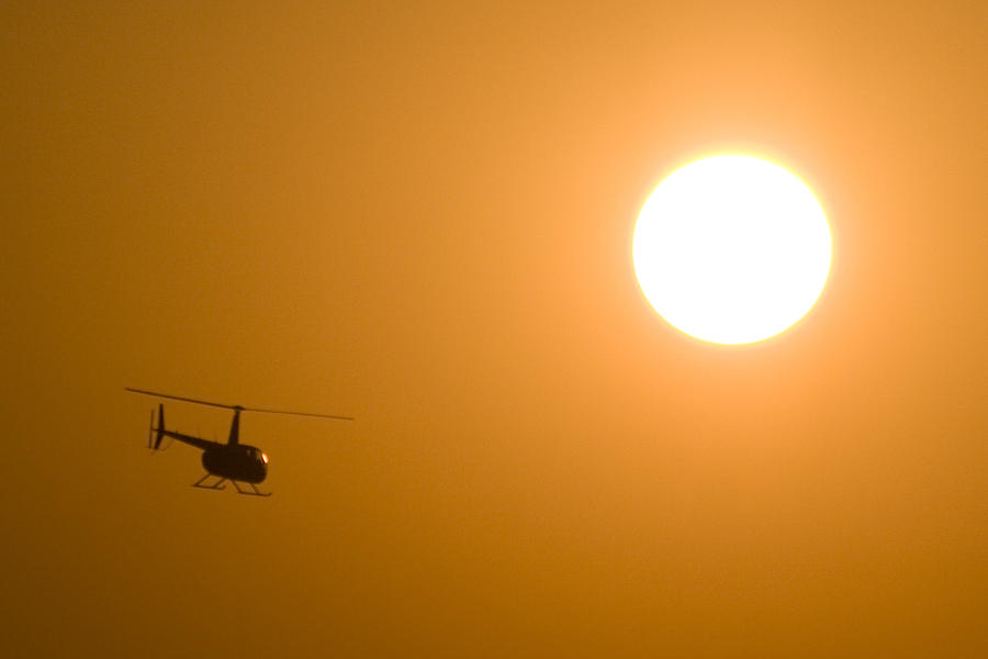 A Helicopter and a Sun Photograph by Paul Job