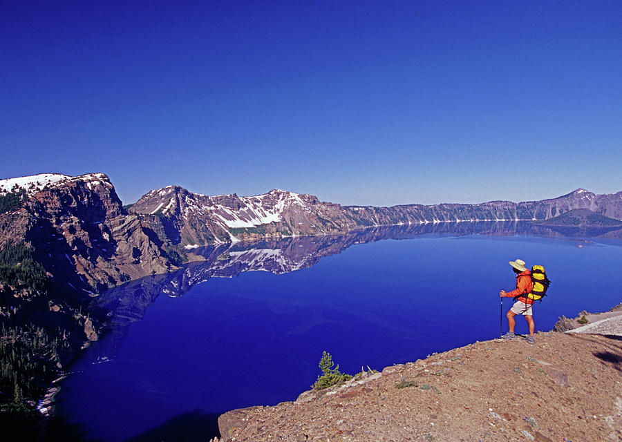 Crater Lake National Park Photograph - A Hiker Enjoys The Spectacular View by Cliff Leight