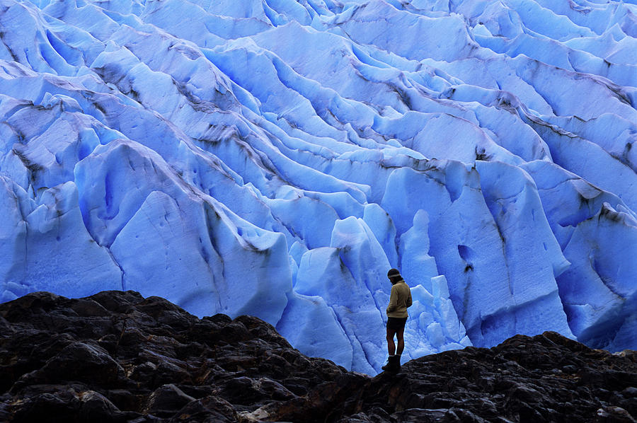 Torres Del Paine National Park Photograph - A Hiker Stands Overlooking A Glacier by Dan Rafla