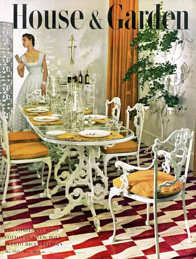 A House And Garden Cover Of A Woman In A Dining Photograph by Horst P. Horst
