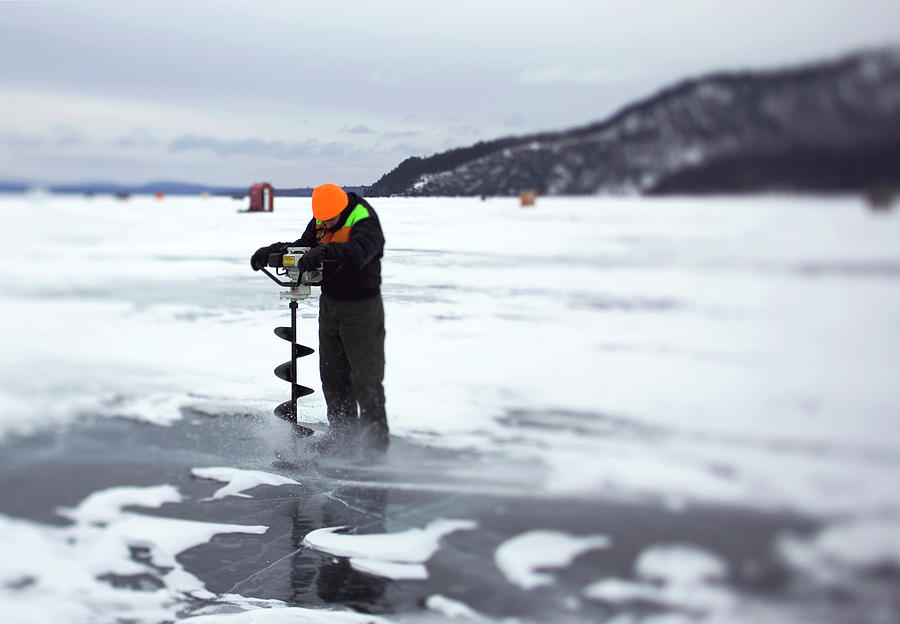 Auger Photograph - A Ice Fisherman Uses An Auger To Drill by David McLain Auger Photograph - A Ice Fisherman Uses An Auger To Drill by David McLain