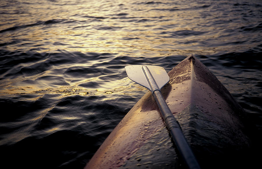 Alone Photograph - A Kayak Floats In The Water by Chris Pinchbeck Alone Photograph - A Kayak Floats In The Water by Chris Pinchbeck