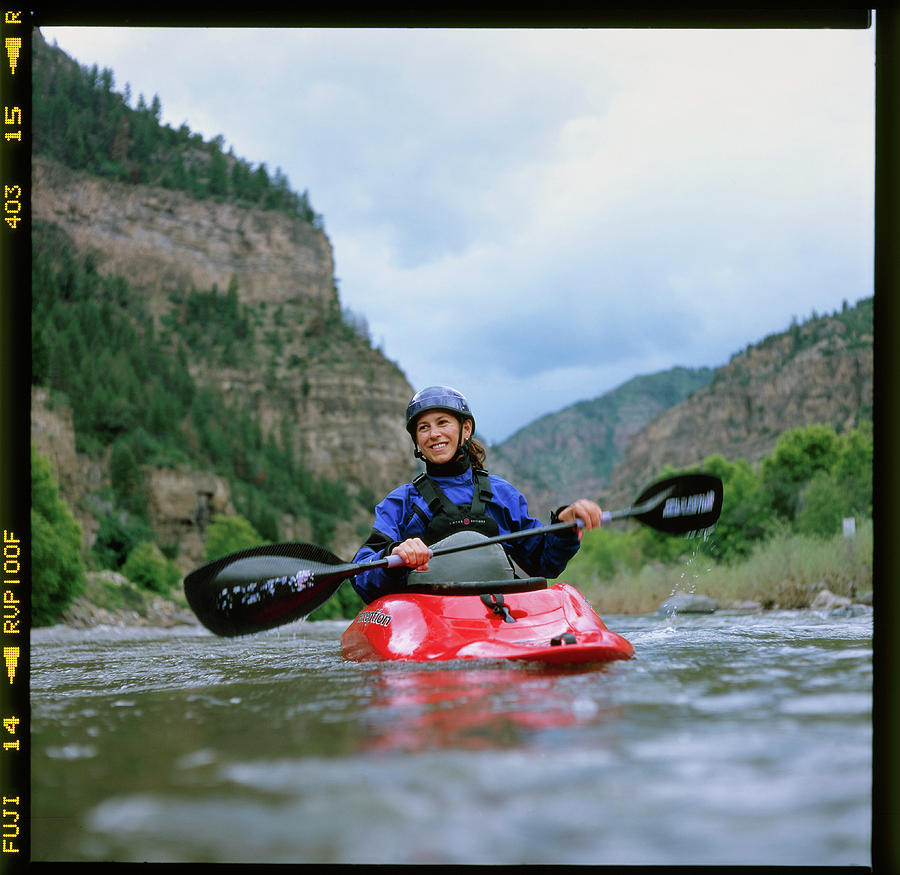 A Kayaker Paddles On The Colorado River Photograph by David Clifford A Kayaker Paddles On The Colorado River Photograph by David Clifford