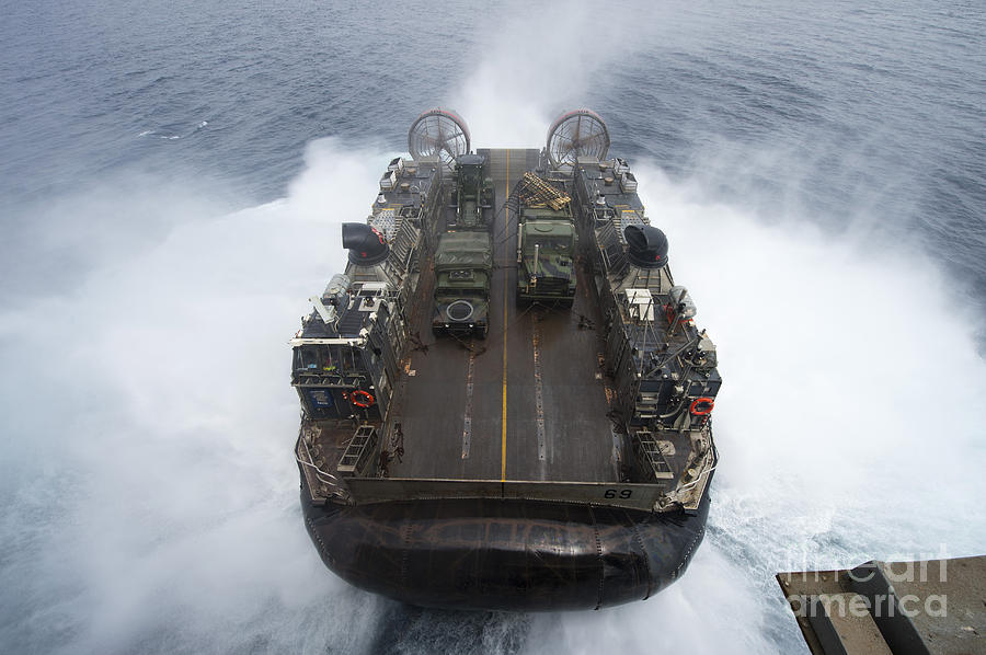 Transportation Photograph - A Landing Craft Air Cushion Leaves by Stocktrek Images