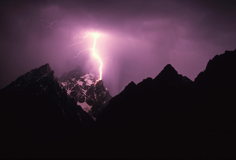 Grand Teton National Park Photograph - A Lightning Bolt Strikes A Mountain Top by Jeff Diener