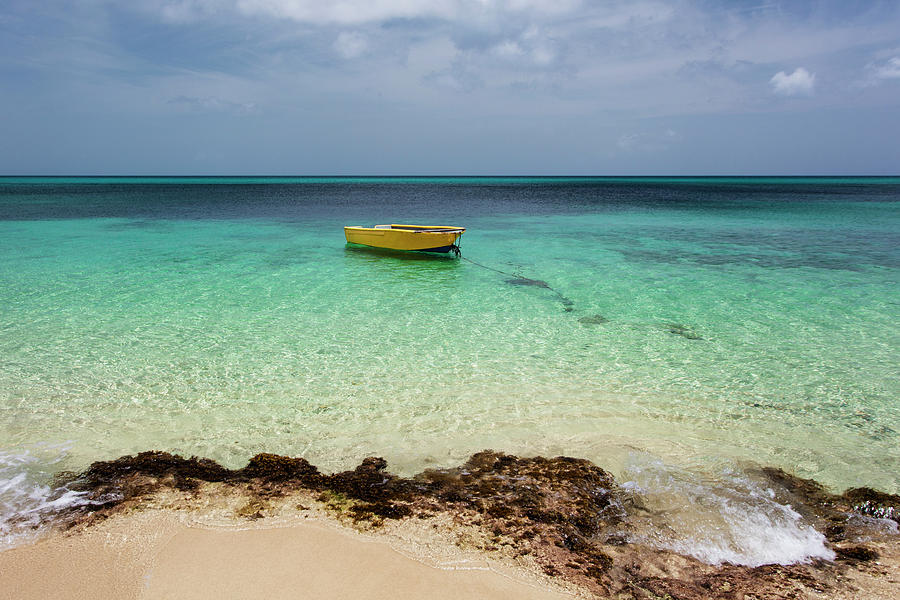 A Lone Boat In The Turquoise Water Photograph by Jenna Szerlag