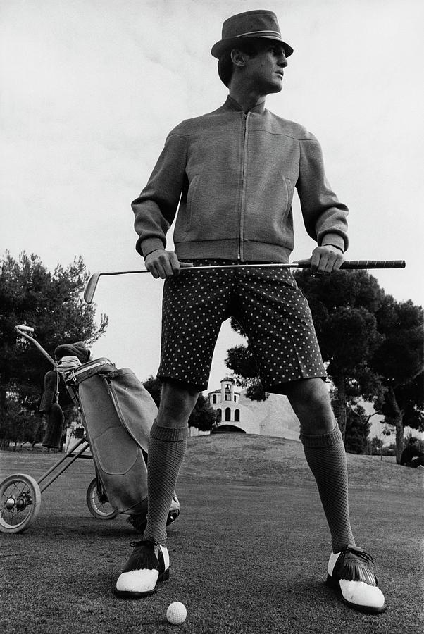 A Male Model Posing As A Golfer Wearing Photograph by Leonard Nones