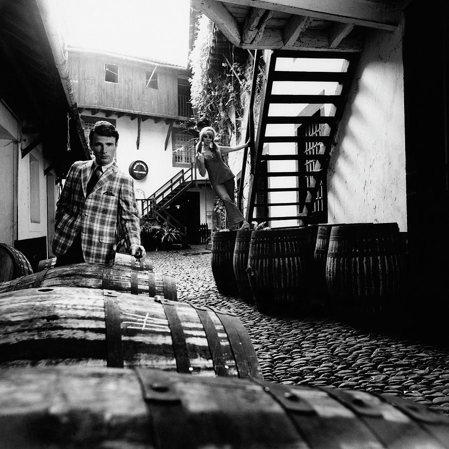 A Male Model Posing By Wine Barrels Photograph by Leonard Nones A Male Model Posing By Wine Barrels Photograph by Leonard Nones