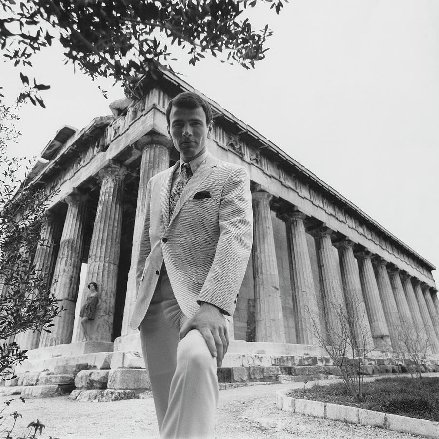 A Male Model Posing In Front Of The Theseion Photograph by Leonard Nones