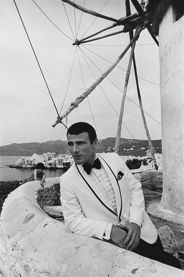 A Male Model Posing On A Terrace In Mykonos Photograph by Leonard Nones