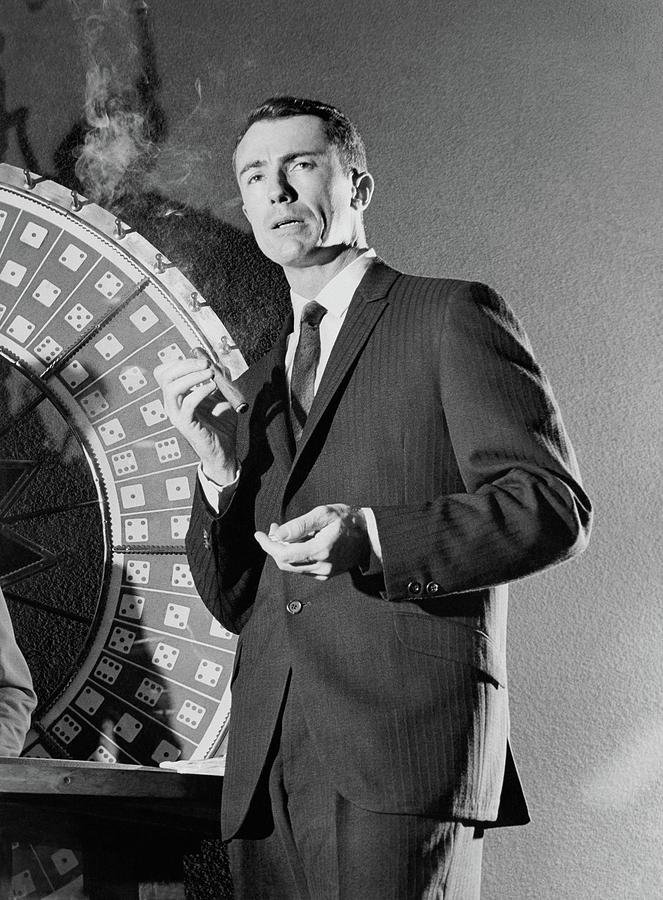 A Male Model Wearing A Dark Pinstriped Suit Photograph by Richard Waite