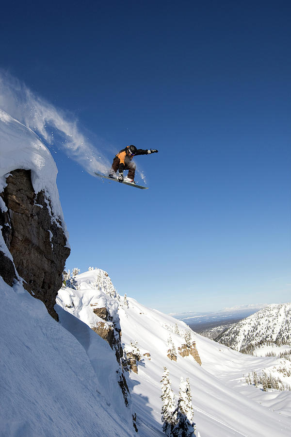 berekenen Overdreven Enzovoorts A Male Snowboarder Jumps Off A Cliff Photograph by Mark Fisher - Pixels