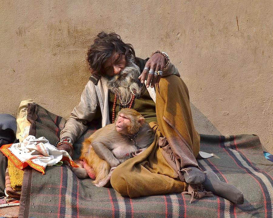 A Man and His Monkey - Varanasi India Photograph by Kim Bemis