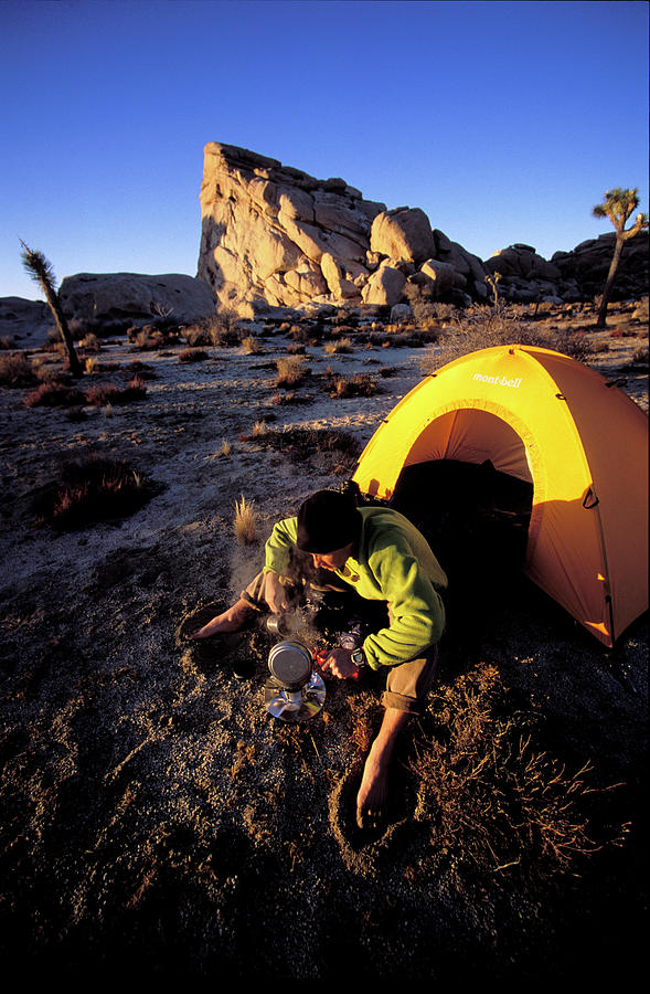 California Photograph - A Man Cooking On A Camp Stove In Front by Corey Rich California Photograph - A Man Cooking On A Camp Stove In Front by Corey Rich