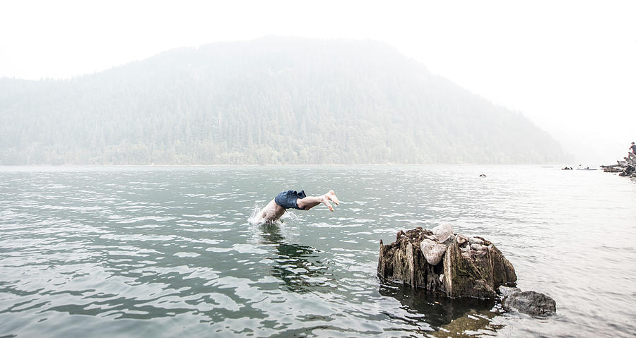 A Man Dives Into The Water Of Yale Lake Photograph by Alasdair Turner ...