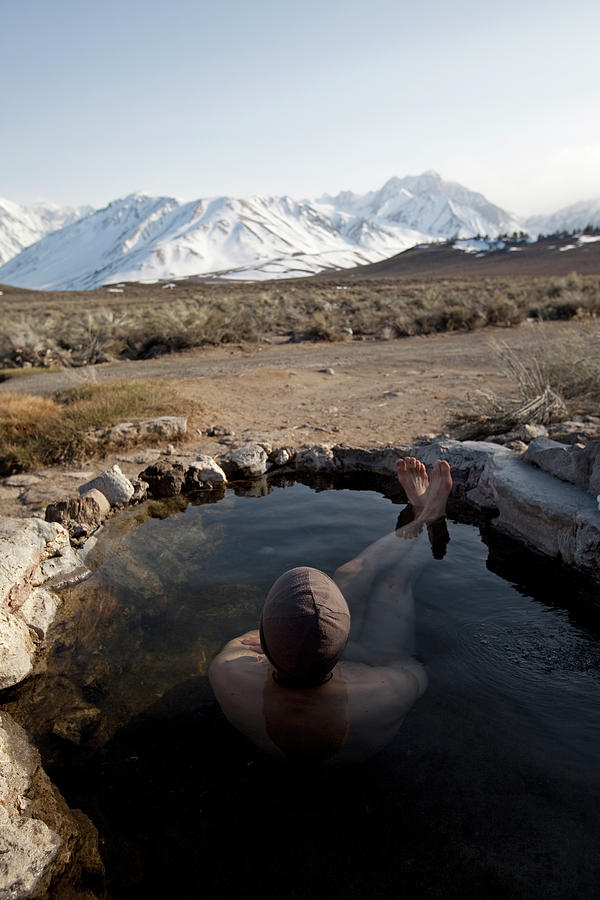 A Man Enjoys A Hot Spring Photograph By Jordan Siemens