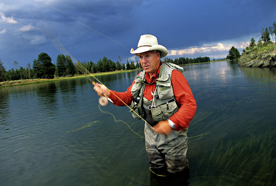A Man In A Cowboy Hat Fly Fishing by Dawn Kish